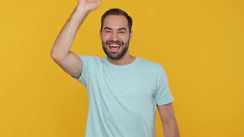 Handsome happy young man guy 20s years old in basic casual blue t-shirt isolated Stock Footage 148283103