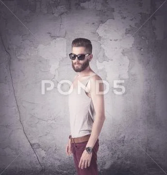 Handsome hipster in fashion clothing Stock Photos