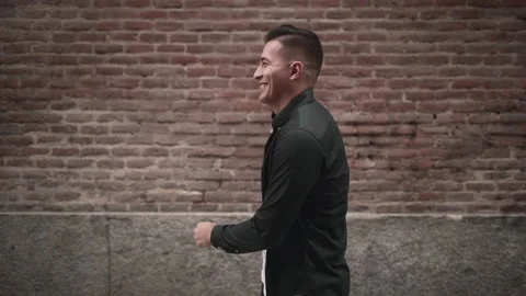 Handsome hispanic guy shows joy with a playful smile in slow motion Video stock 205306561