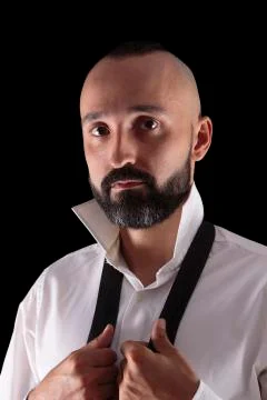 Handsome hispanic man dressing up looking at camera Stock Photos