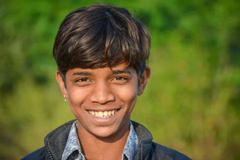 An handsome Indian boy smiling at the camera. Stock Photos