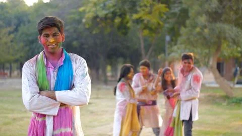 Handsome Indian guy having fun at the exciting color festival Holi - festive ... Stock Photos
