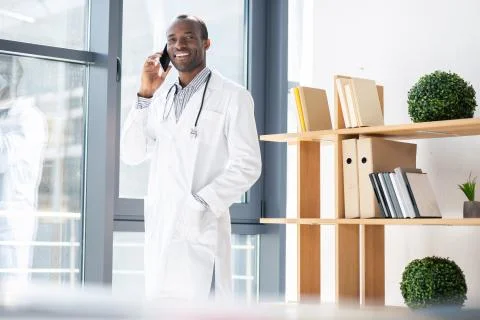 Handsome international practitioner posing on camera Stock Photos