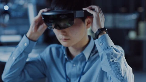 Handsome Japanese Electronics Development Specialist is Putting on AR Headset Stock Footage 105341694