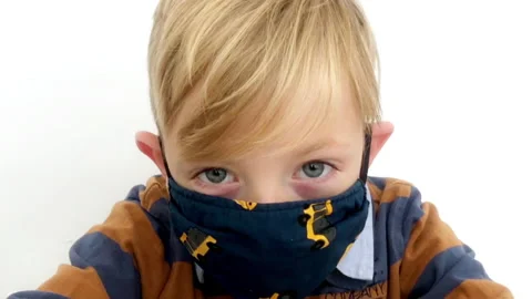 Handsome kid in mask curiosity looking at camera white background corona virus. Stock Footage 158593756