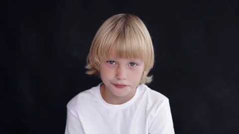 Handsome little boy looking at the camera and smiling. Stock Footage 145190799