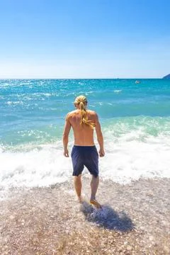Handsome Long Haired Man Diving Into Adriatic Sea Bar Montenegro. Stock Photos