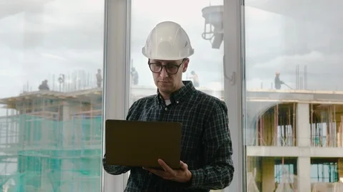 Handsome male engineer is using a notebook for work. 스톡 동영상 115454966