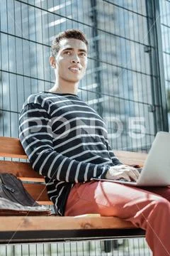 Handsome male freelancer responding on business correspondence Stock Photos