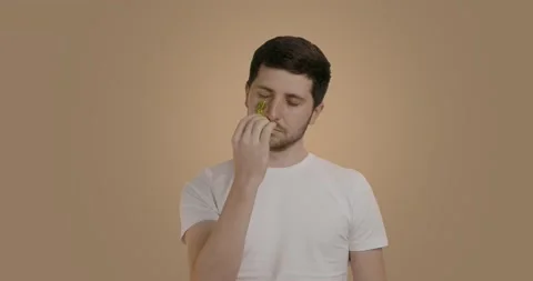 Handsome male model using modern beauty stone tool massaging face for skin care Stock Footage 226416613