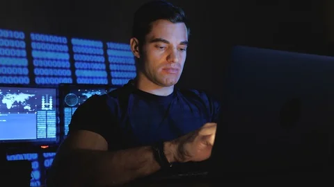 Handsome male programmer geek working at a computer at night in the office Stock Footage 102901914