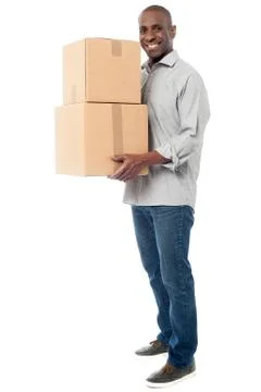 Handsome male with with stack of boxes Stock Photos