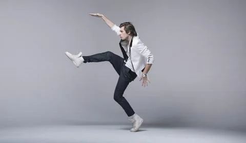 Handsome man in acrobating pose Stock Photos