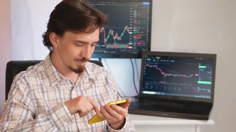 Handsome man against background of screens and computers, cryptocurrency Stock Footage 198560962