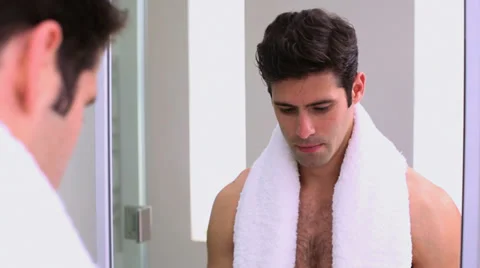 Handsome man applying shaving foam Stock Footage 32879269