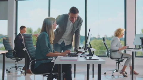Handsome man asking co-worker for help Stock-Footage 164554709