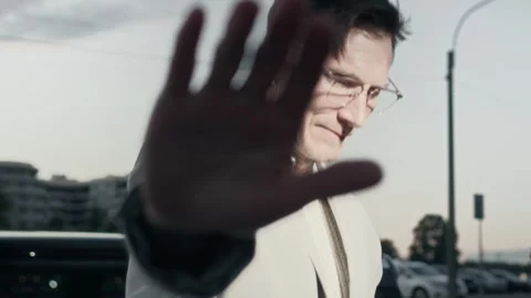 Handsome Man Avoiding Paparazzi while Getting out of Car Stock Footage 281565510