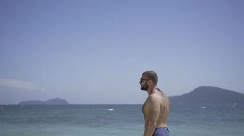 Handsome man is on the beach. Stock Footage 60780231