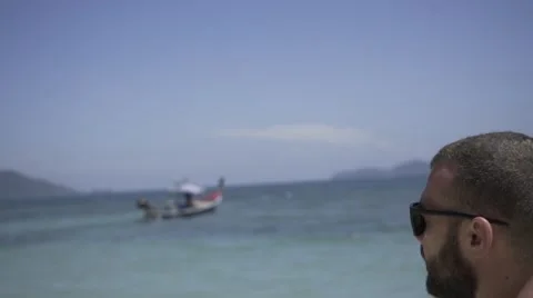 Handsome man is on the beach. Stock Footage 60780286
