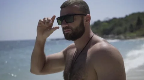 Handsome man is on the beach. Stock Footage 60780338
