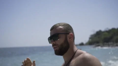 Handsome man is on the beach. Stock Footage 60780342