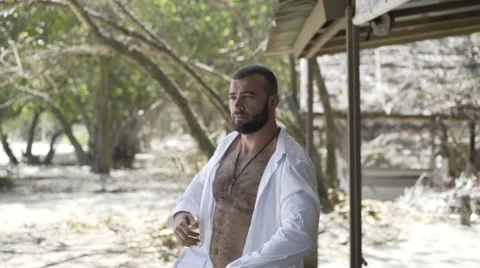 Handsome man is on the beach. Stock Footage 60780499