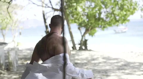 Handsome man is on the beach. Stock Footage 60780501