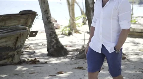 Handsome man is on the beach. Stock Footage 60780587