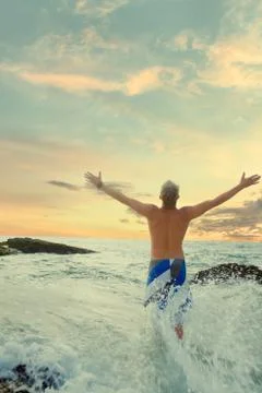 Handsome man on beach Stock Photos