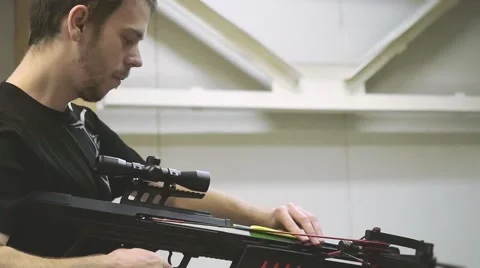 Handsome man with a bow and arrowss hoots with a crossbow in the dash in Video stock 61542744