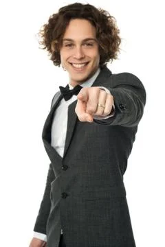 Handsome man in bow tie pointing you out Stock Photos