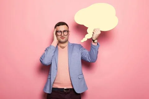 Handsome man in bright jacket with speech bubble 写真素材