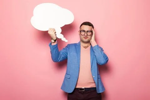 Handsome man in bright jacket with speech bubble Foto stock