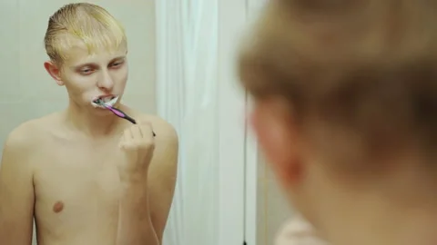 Handsome Man Brush Teeth Looking Face In Front Of Mirror. Sexy Man At Bathroom. Stock Footage 143669486