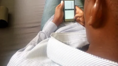 Handsome Man Busy Working from Home on His Smartphone Stock Footage 146127609
