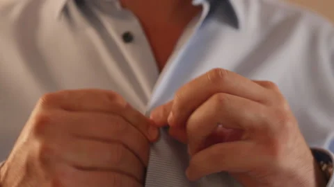Handsome Man Buttons His White Shirt Standing Isolated. Stock Footage 253727807