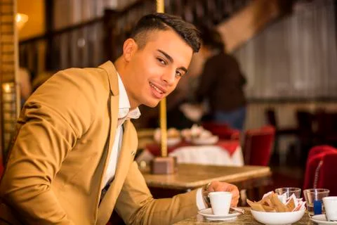 Handsome man in cafe Stock Photos