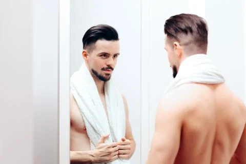 Handsome Man Checking Himself in the Mirror Foto stock