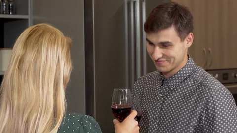 Handsome man clinking glasses with his girlfriend celebrating buying new home Stock-Footage 102895555
