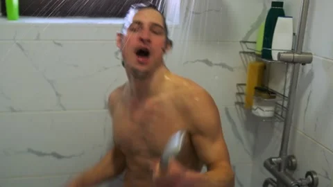 Handsome man dances in shower, infusing morning with energy and joy. Stock Footage 307887875