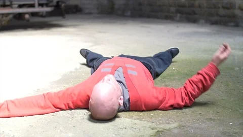 Handsome Man Dancing on floor, no hair, in an old train factory Stock Footage 104463642