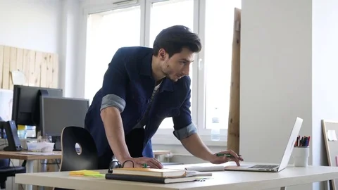 Handsome man, designer working in creative agency office Stock Footage 72874933