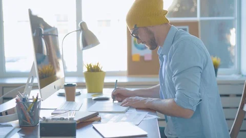 Handsome man, designer working in creative agency office Stock Footage 123916354
