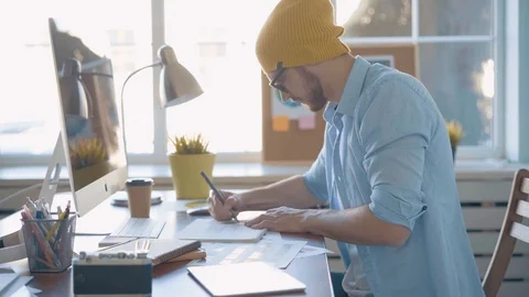 Handsome man, designer working in creative agency office Stock Footage 123916355