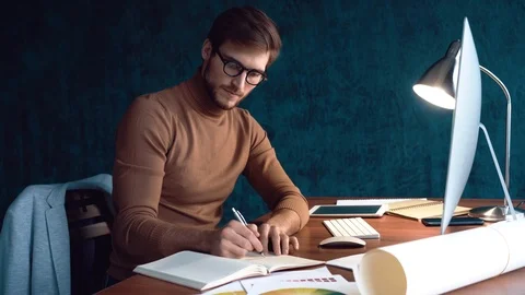 Handsome man, designer working in creative agency office Stock Footage 123916393