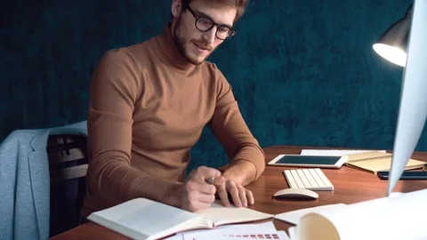 Handsome man, designer working in creative agency office Stock Footage 123916395