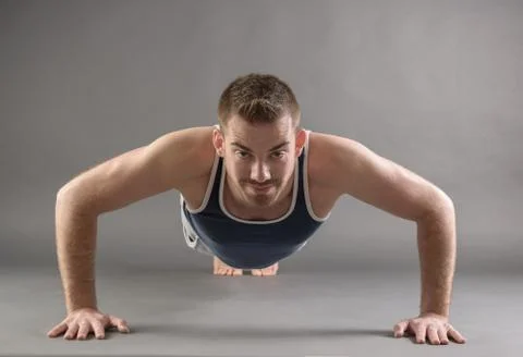 Handsome man doing push ups Foto stock