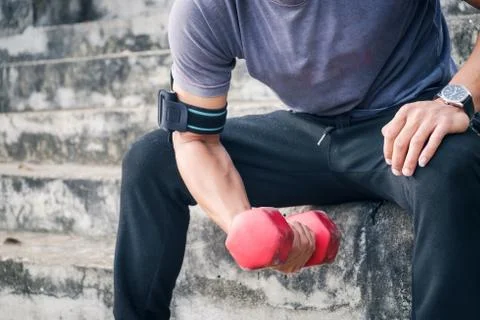 Handsome man doing push ups exercise with one hand in fitness Stock Photos