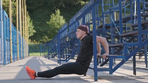 Handsome man doing workout for arms on stairs. Fitness training outdoors. 스톡 동영상 115028747
