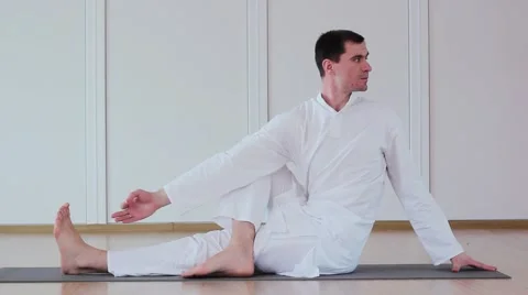 Handsome Man Doing Yoga. Parivrttasana Stock Footage 59730028